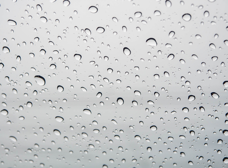 Many of raindrops stuck on the windshield background,Abstract of raindrops on the mirror.の写真素材