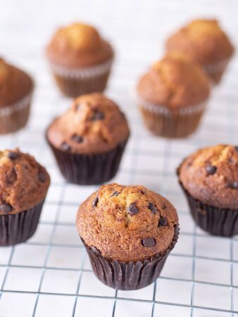 Top view close up brown muffin or banana cake on white table background for breakfast in morning day.の写真素材