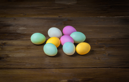 Colorful Easter eggs on old rustic wooden backgroundの写真素材