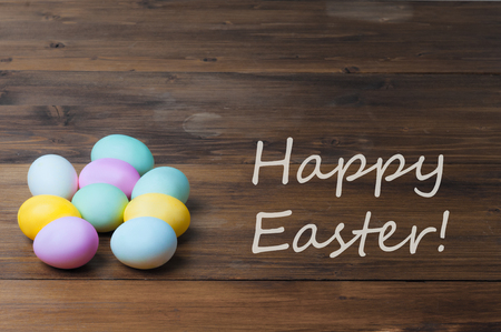 Colorful Easter eggs on old rustic wooden backgroundの写真素材