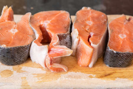 Red salmon fish. Salmon steaks. Healthy eating red salmon fish. Photo on fish production.の写真素材
