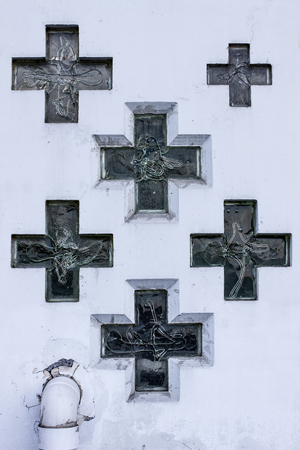 Wall of church with glass christian crossesの写真素材
