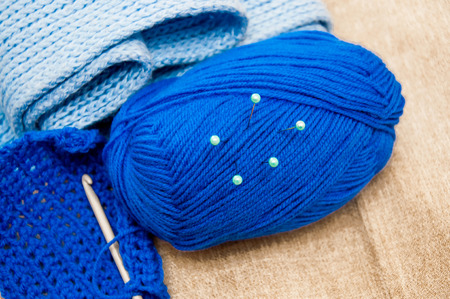 Knitting set which includes sewing pins, thread ball and knitting needle