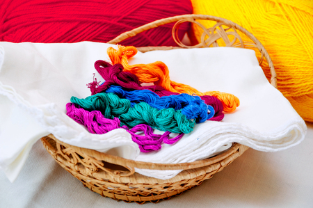 Colorful threads in the basket with thread ballsの写真素材