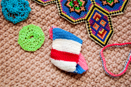 Crochet abstract things on the crochet backgroundの写真素材