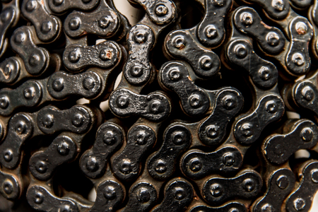 Rusty dirty metal bicycle chain in circle shape