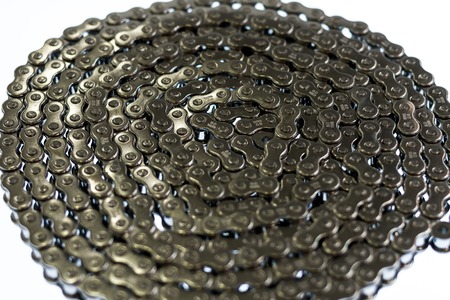 Modern metal bicycle chain on the white backgroundの写真素材