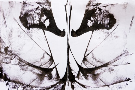 Abstract black spot paint on white paperの写真素材