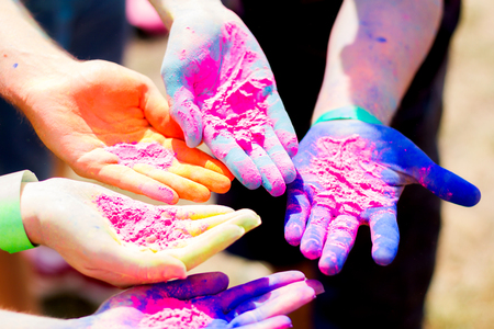Close up shooting of  hands holding colorful powder for Holi celebrationの写真素材