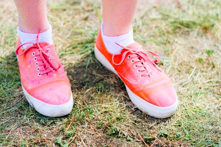 Body parts.Close-up shooting of girl's feet wearing pink sneakersの写真素材