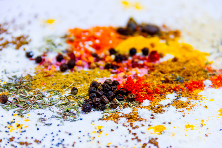 Mix of herbs and spices isolated on white backgroundの写真素材