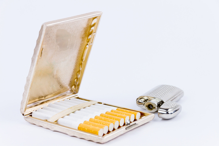 Cigar case and a silver lighter isolated on white backgroundの写真素材