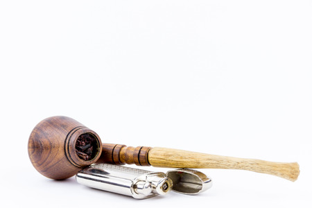 A wooden pipe and a silver lighter isolated on white backgroundの写真素材