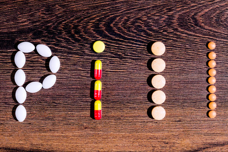 Pharmaceutical medicaments. Word "pill" built with the help of colorful tablets.の写真素材
