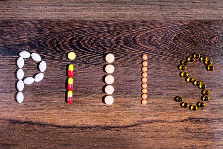 Pharmaceutical medicaments. Word "pill" built with the help of colorful tablets.の写真素材