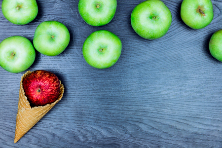 Healthy ice-cream. Healthy food: Apples in wafer cup isolated on grey  backgroundの写真素材
