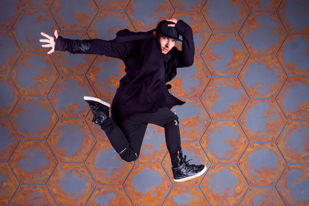 Guy break dancing in the air. Urban style