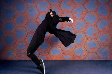 Young dancer standing on his tiptoes. Urban styleの写真素材