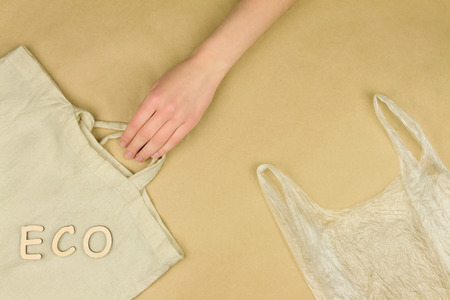 Disposable plastic polythene grocery bag compare to reusable grocery textile bag. Refuse, reuse and recycle concept. Ecology, environment and planet care. Green planet concept.の写真素材