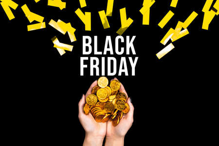 Female hands are holding golden dollar euro coins. Woman prepared money for shopping. Black friday concept. Seasonal discount sale. Special prices. Best deal offer to buy cheap goods, gifts.の写真素材