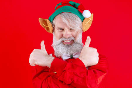 Happy, old man with long white beard and mustache dancing, posing, smiling shows thumbs up. Positive...