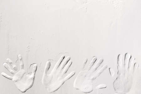 Handprint printed on white flour, sand, powder, dough. Baking, cooking food meal background. Top...