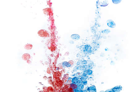 Blue and red paint drops in oil. Macro shot, abstract background with ink and water. Bubbles floating in space and falling. Beautiful acrylic paint. Fluid art, psychedelic abstract wallpaper.の写真素材