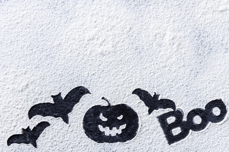 Halloween witch scary elements, funny recipe for party.  Silhouettes of pumpkin ghosts bats web on the white flour. Preparing for autumn festival celebration. Trick or treat holiday concept top view.の写真素材