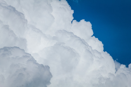 background bright blue sky with cloudsの写真素材