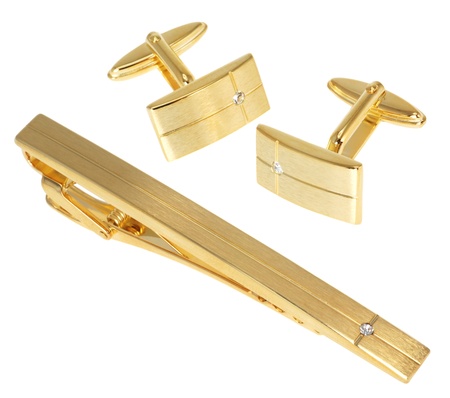 golden cuff link and tie pin isolated on whiteの写真素材