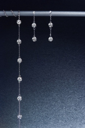 still life with jewelry on blue backgroundの写真素材