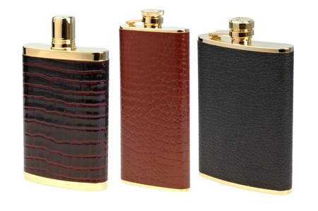   set of leather flasks for alcohol isolated on whiteの写真素材