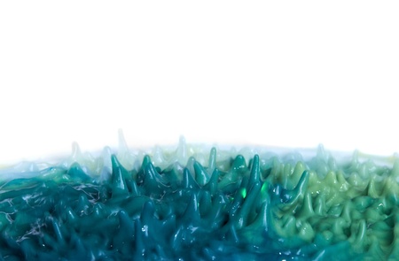 Abstract background with splashes of blue and yellow paintの写真素材