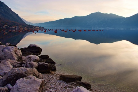 waterscape with mountain and mussel farm with perfect  mirror imageの写真素材