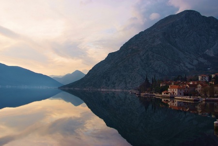 waterscape with mountain and old town with perfect  mirror imageの写真素材