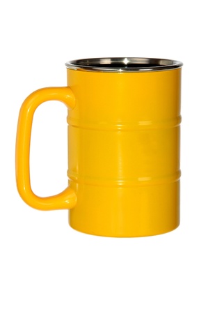 yellow metal barrel shaped mug isolated on whiteの写真素材