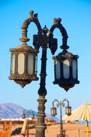 old rusty street lamps on the beachの写真素材