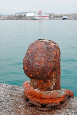 A rusty bollard. Abstract travel background.の写真素材