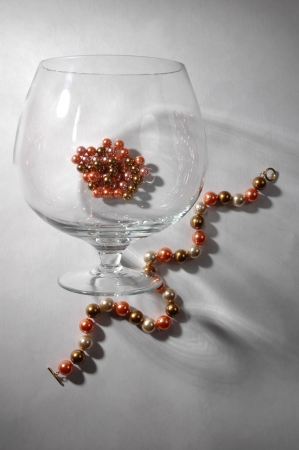 large wine glass and pearl necklaceの写真素材