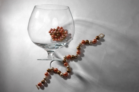large wine glass and pearl necklace and nice shadowの写真素材