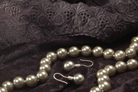 pearl necklace and earrings on black velvetの写真素材