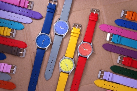 composition of colourful watches on cardboard backgroundの写真素材
