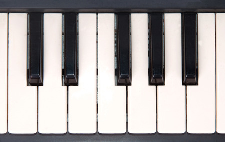 closeup view of piano keyboard isolated on white