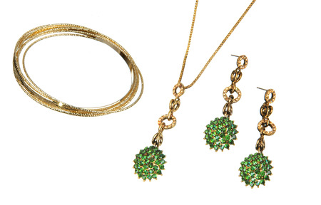 pretty pendant and couple of earrings isolated on whiteの写真素材