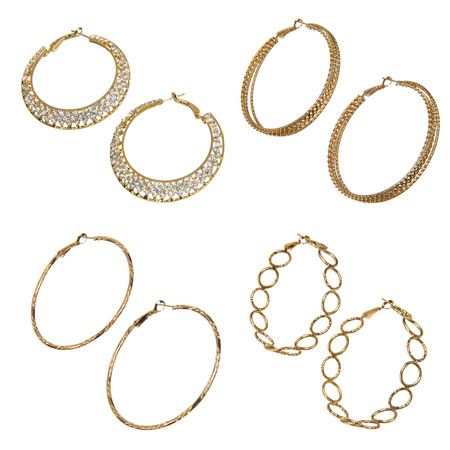 set of golden earrings isolated on whiteの写真素材