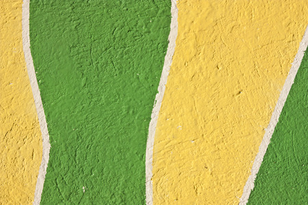 yellow and green textured stucco background の写真素材