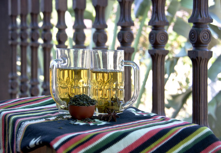 healthy green tea cups with tea leavesの写真素材