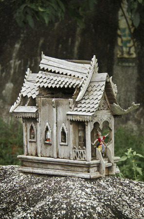 old broken wooden spirit house in thailandの写真素材