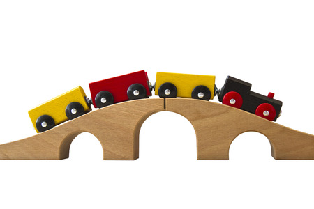 wooden toy train isolated on whiteの写真素材