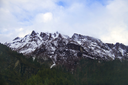 Gorgeous snow cold Himalayan peaks in front of the blue skyの写真素材